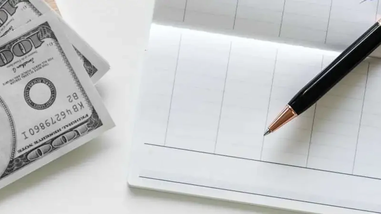 Close up on a plate of mashed potatoes, topped with baked pork chops with cream of mushroom soup, and a side of green beans.