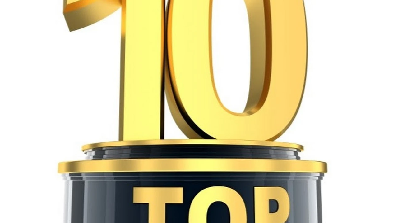 Close up on a plate of mashed potatoes, topped with baked pork chops with cream of mushroom soup, and a side of green beans.